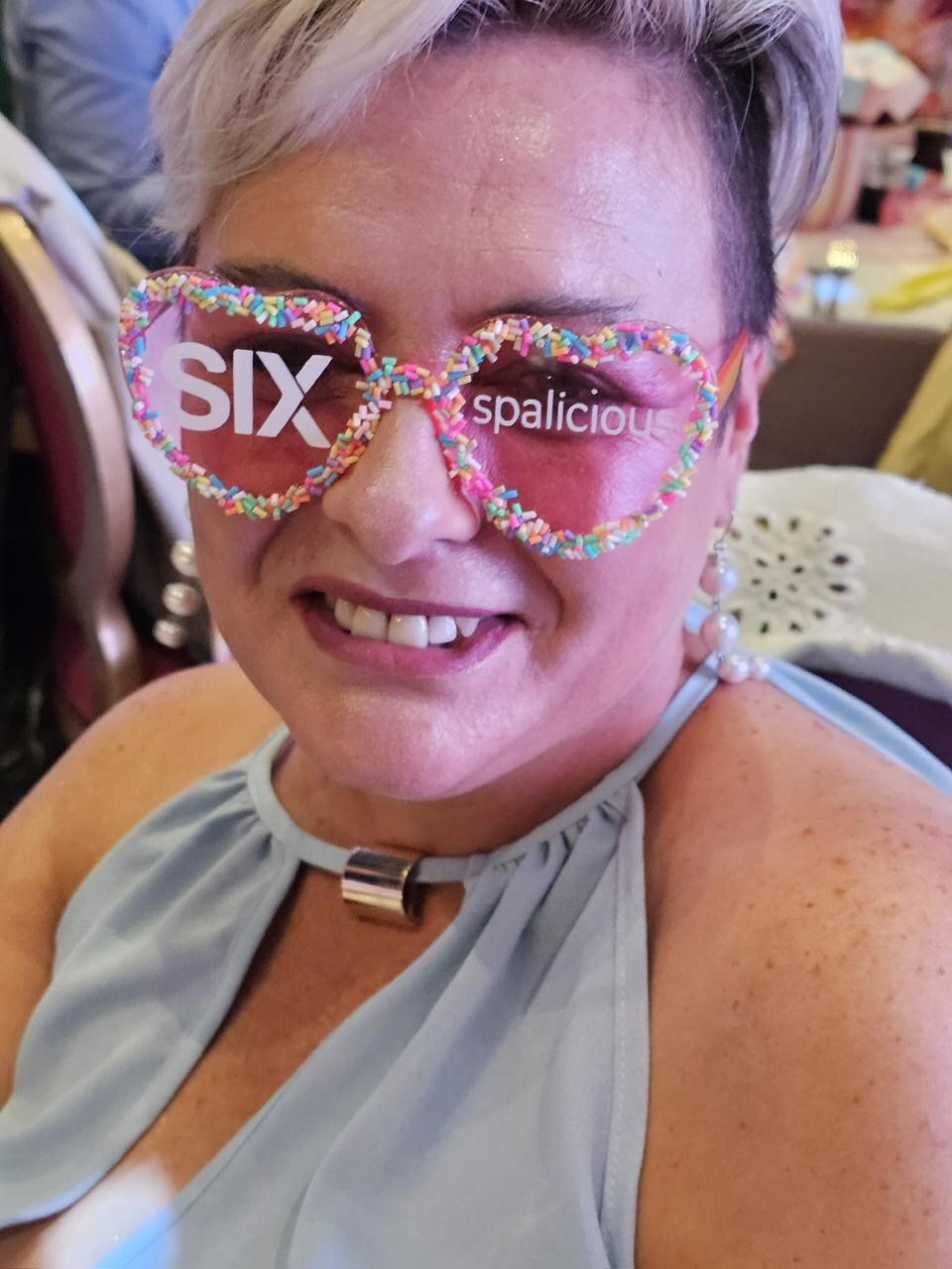 Guest wearing branded Candyland glasses